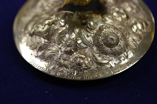 A George III silver gilt two handled presentation pedestal cup and cover by Soloman Hougham and a pair of similar goblets, 47.5 oz